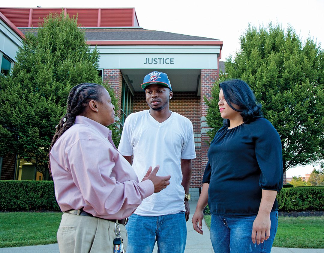 College Unbound Case Manager Wanda Brown (left) talks with Keila Fiorentino (right) and Marquese Jones, who was introduced to the Bridge Program shortly before his release in April. “Coming home with a felony, I knew the best thing to do was get an education,” says Jones, adding that Brown has been instrumental in keeping him focused on that goal.