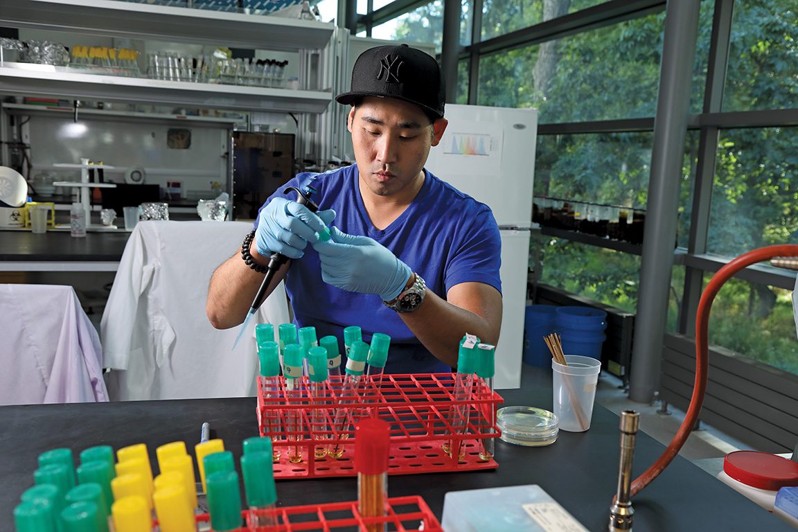 Paul Kim, a BPI student who was imprisoned for 17 of his 35 years, is now out on parole, finishing up his senior chemistry project. Here he works in a Bard College biotech lab, doing interspecies comparative genetics research.